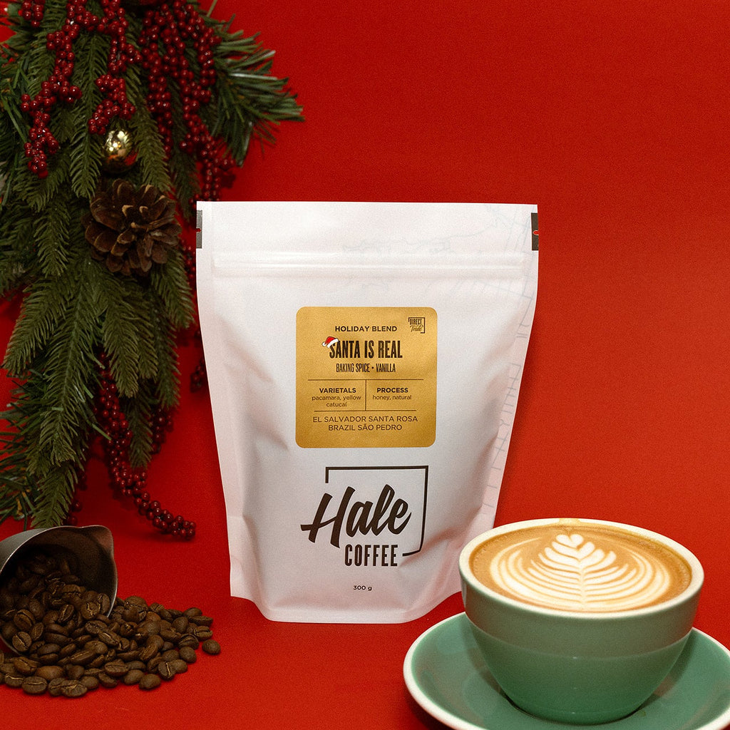 Hale Coffee package with a cup of coffee and Christmas decorations on a red background